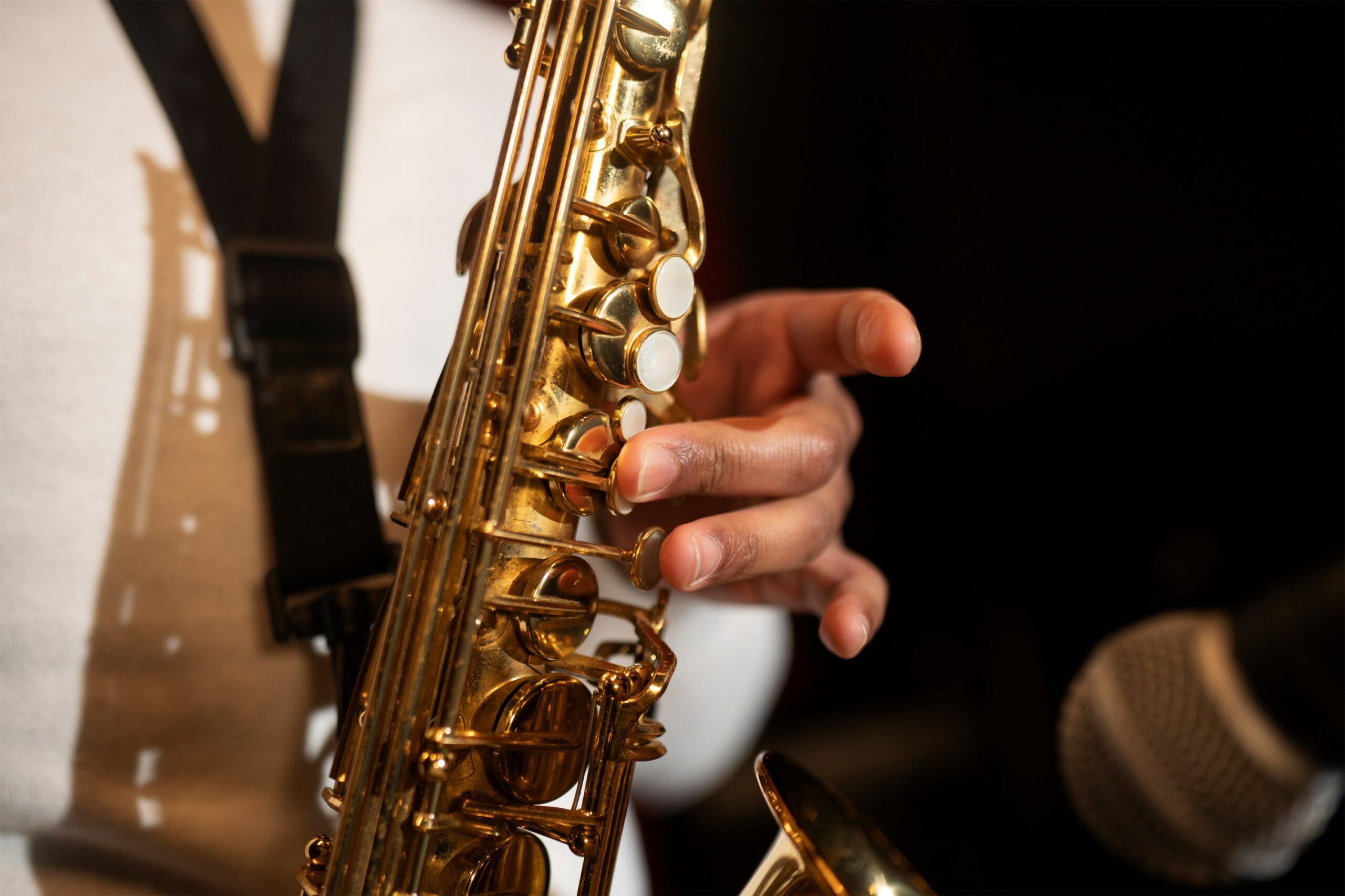 close-up-hand-playing-saxophone-min