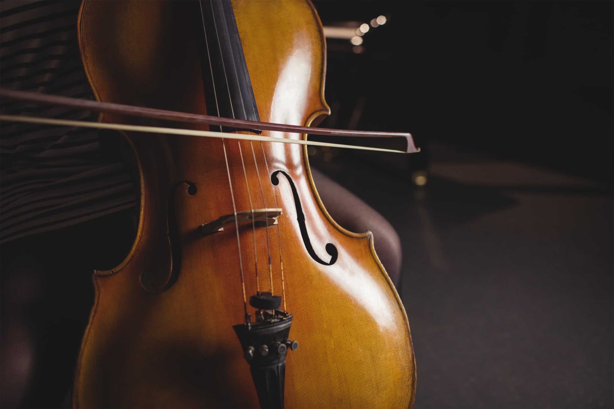 mid-section-female-student-playing-double-bass-min